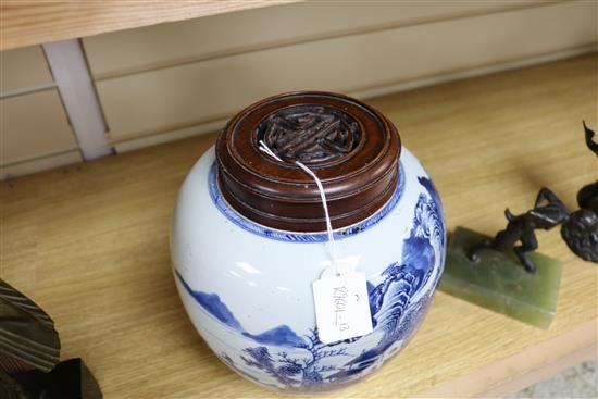 A Chinese blue and white ovoid jar, 18th century, total height 23.5cm including pierced wood cover